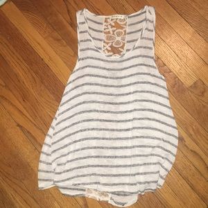 White tank top with stripes and design on back